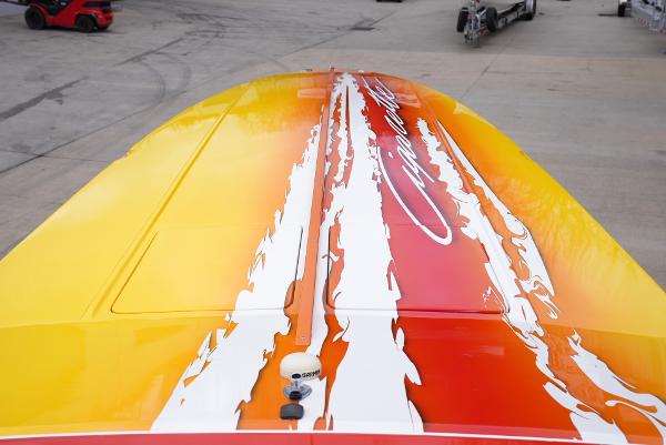 Slide: The Image of 2005 Cigarette 38 Top Gun boat with vibrant yellow and red flame design. - 5