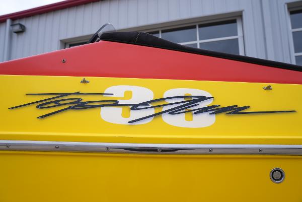 Slide: The Image of 2005 Cigarette 38 Top Gun boat with yellow and red exterior. - 6