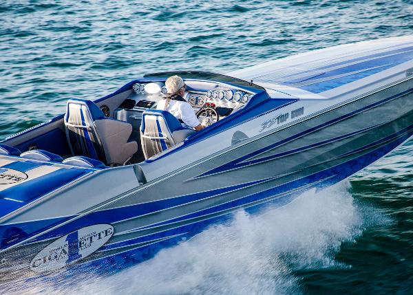 Slide: The Image of 2025 Cigarette 38 Top Gun speedboat cruising on the water. - 2