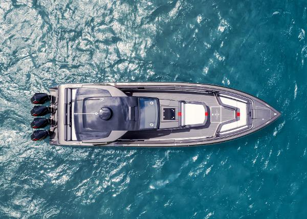 Slide: The Image of Aerial view of 2025 Cigarette 41 Nighthawk boat on blue water. - 13