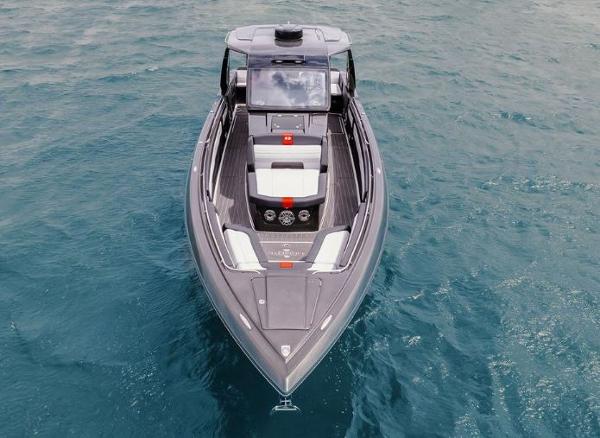Slide: The Image of 2024 Cigarette 41 Nighthawk boat on open water, aerial view. - 2