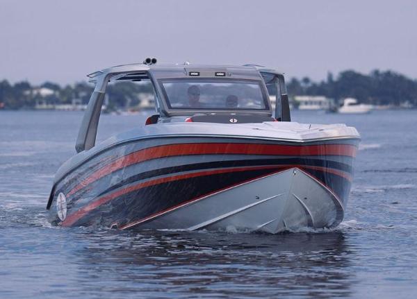 Slide: The Image of 2024 Cigarette 41 Nighthawk boat on water, front view. - 5