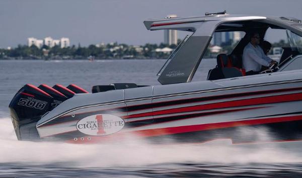 Slide: The Image of 2024 Cigarette 41 Nighthawk speedboat cruising on water with powerful engines. - 6