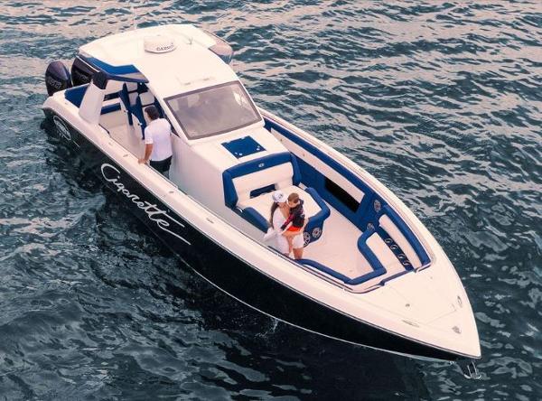 Slide: The Image of 2024 Cigarette 41 Nighthawk boat on water with people onboard. - 8