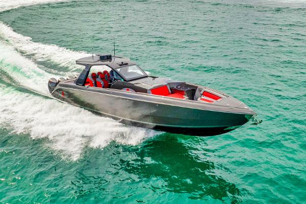 Slide: The Image of 2025 Cigarette 42 Nighteagle speedboat cruising on clear turquoise waters. - 6