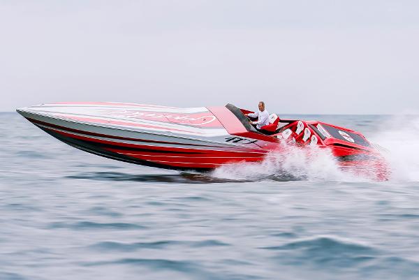 Slide: The Image of 2025 Cigarette 42X speedboat racing on open water. - 1