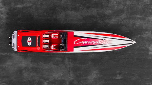 Slide: The Image of Top view of 2025 Cigarette 42X speedboat with red and white design. - 2
