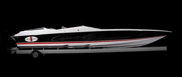 Slide: The Image of 2025 Cigarette 42' X speedboat on trailer, black and white with red accents. - 2