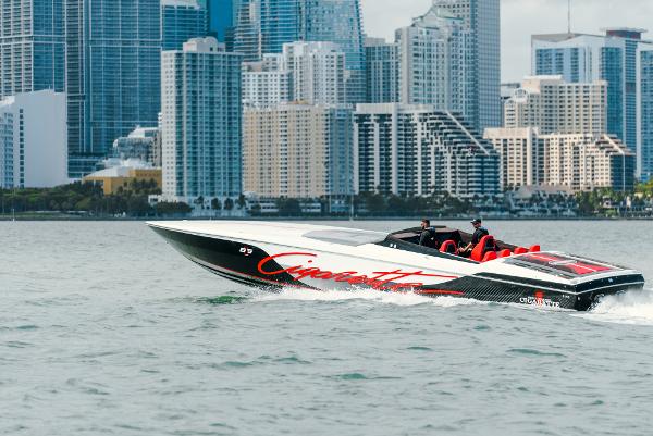 Slide: The Image of Cigarette 515 speedboat cruising near city skyline, 2022 model. - 0