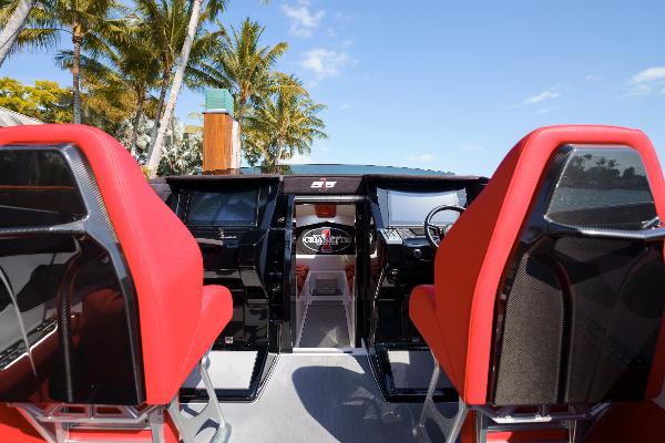 Slide: The Image of Interior of 2022 Cigarette 515 boat with red seats and modern dashboard. - 5