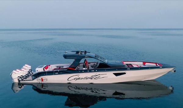 Slide: The Image of 2024 Cigarette 52 Thunder luxury speedboat on calm water. - 1
