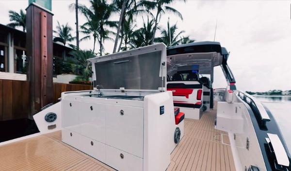 Slide: The Image of 2024 Cigarette 52 Thunder luxury boat interior with open storage compartment. - 10