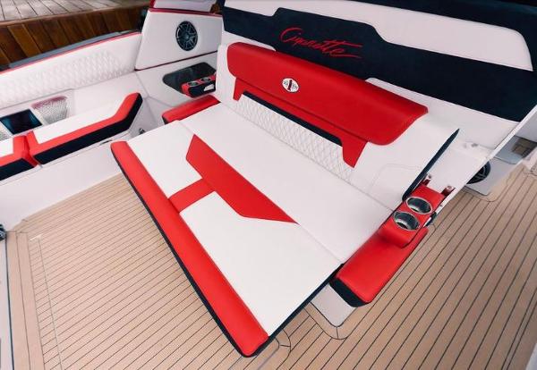 Slide: The Image of 2024 Cigarette 52 Thunder boat interior with red and white seating. - 12