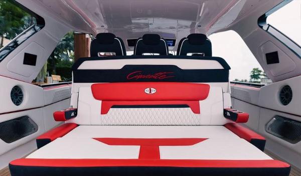 Slide: The Image of 2024 Cigarette 52 Thunder luxury boat interior with red and white seating. - 13
