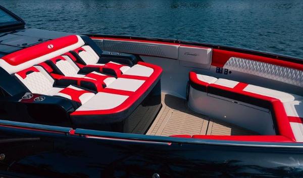 Slide: The Image of 2024 Cigarette 52 Thunder boat with luxurious red and white seating on the water. - 14