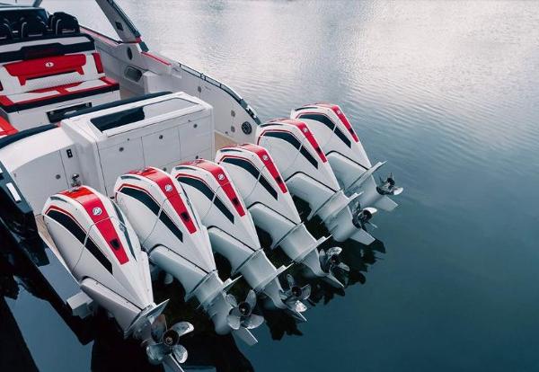 Slide: The Image of 2024 Cigarette 52 Thunder boat with five powerful outboard engines on water. - 4