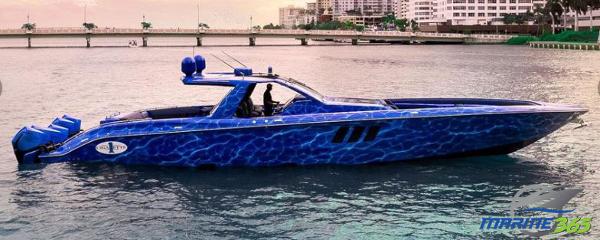 Slide: The Image of 2024 Cigarette 59 Tirranna luxury speedboat with blue water-themed design on a calm waterway. - 0