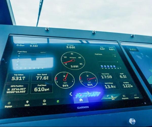 Slide: The Image of Garmin display on 2024 Cigarette 59 Tirranna boat dashboard showing navigation and performance data. - 10