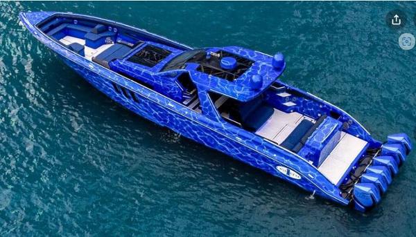 Slide: The Image of 2024 Cigarette 59 Tirranna luxury speedboat with blue water-themed design on the ocean. - 13