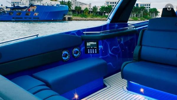 Slide: The Image of Interior of 2024 Cigarette 59 Tirranna luxury boat with blue seating and modern controls. - 14