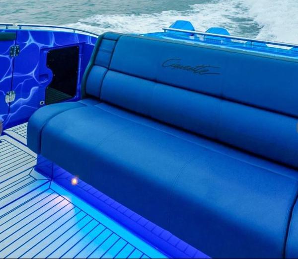 Slide: The Image of 2024 Cigarette 59 Tirranna boat with blue seating and LED lighting. - 2