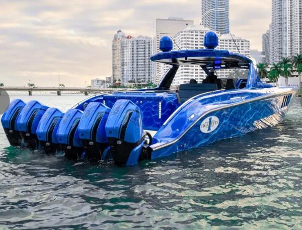 Slide: The Image of 2024 Cigarette 59 Tirranna luxury speedboat with six outboard engines in a city marina. - 7