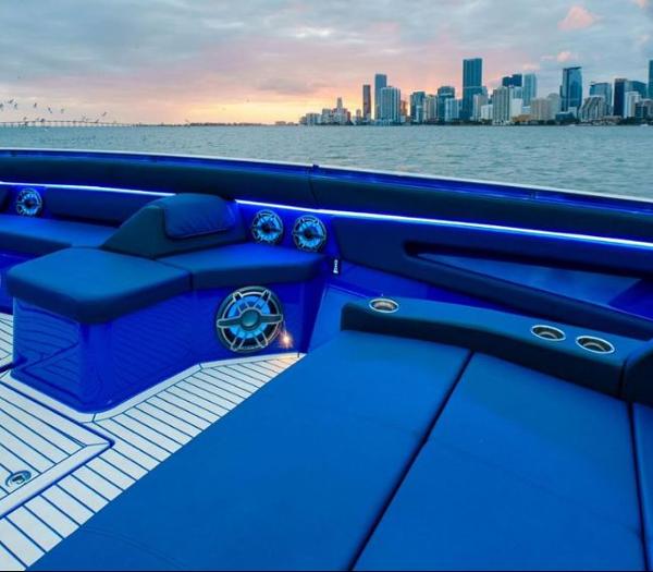 Slide: The Image of 2024 Cigarette 59 Tirranna luxury boat interior with city skyline at sunset. - 9