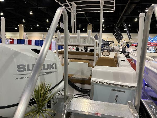 Slide: The Image of 2024 Clearwater 2000 boat with Suzuki engine at indoor boat show. - 19