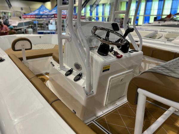 Slide: The Image of 2024 Clearwater 2000 boat interior with steering console and seating. - 4