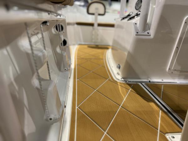 Slide: The Image of Clearwater 2000 boat interior, 2024 model, featuring sleek wooden flooring and modern design. - 6