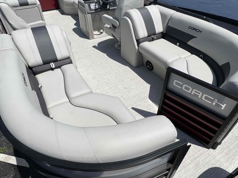 Slide: The Image of 2023 Coach 223 RFC boat interior with luxurious gray seating and modern dashboard. - 10