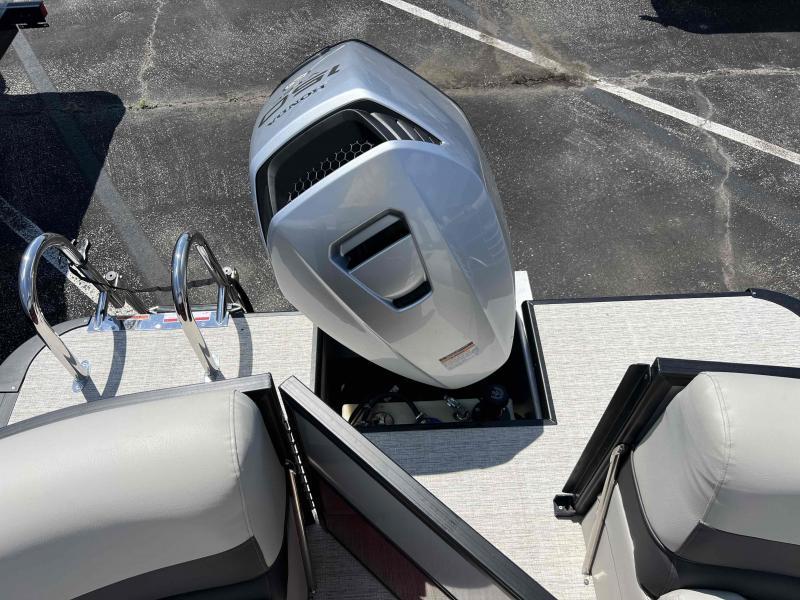 Slide: The Image of 2023 Coach 223 RFC boat with outboard motor and seating area. - 11