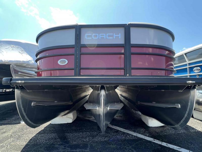 Slide: The Image of 2023 Coach 223 RFC pontoon boat, front view, red and black, parked on a lot. - 3