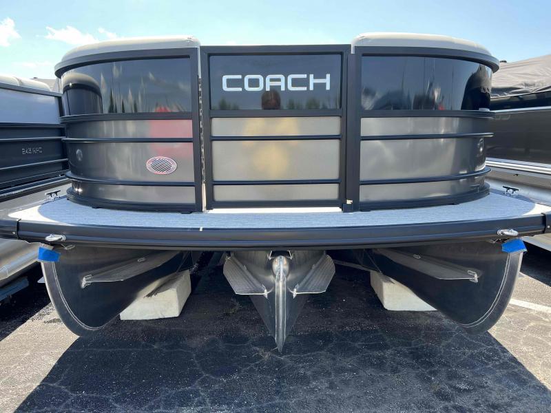Slide: The Image of 2023 Coach 223 RFC pontoon boat, front view, black exterior, parked on asphalt. - 3