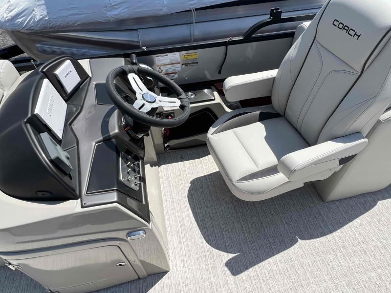 Slide: The Image of 2023 Coach 223 RFC boat cockpit with steering wheel and captain's chair. - 6