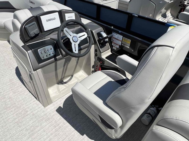 Slide: The Image of 2023 Coach 223 RFC boat cockpit with steering wheel and control panel. - 6