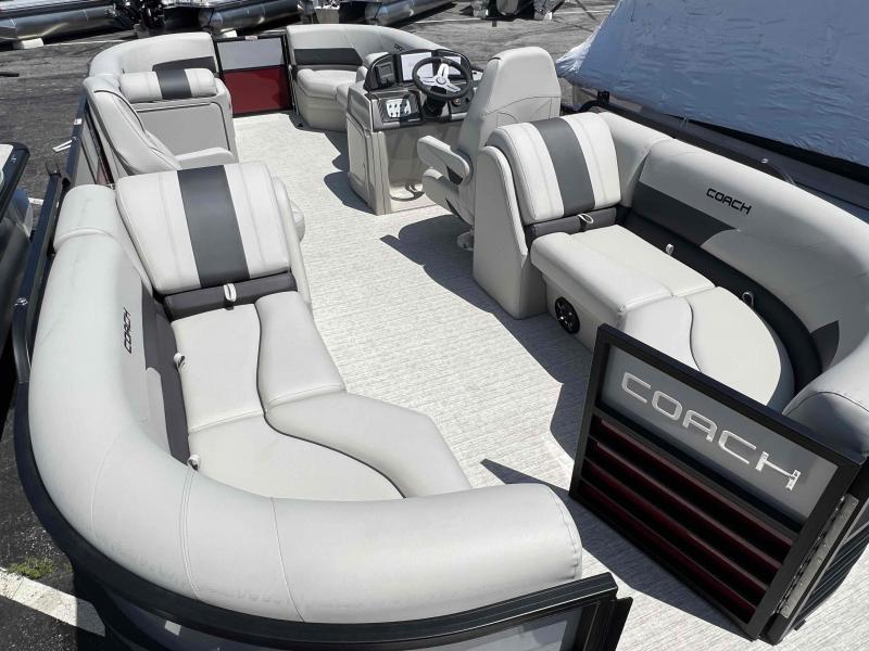 Slide: The Image of 2023 Coach 223 RFC pontoon boat interior with luxurious seating and modern helm. - 9