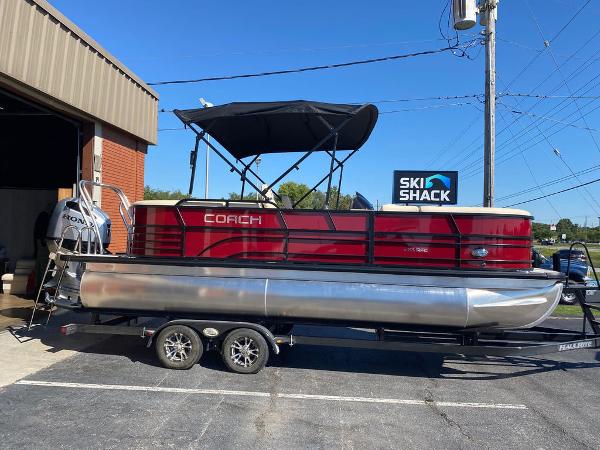 Slide: The Image of 2023 Coach Pontoons 223RFC pontoon boat parked outside Ski Shack. - 0