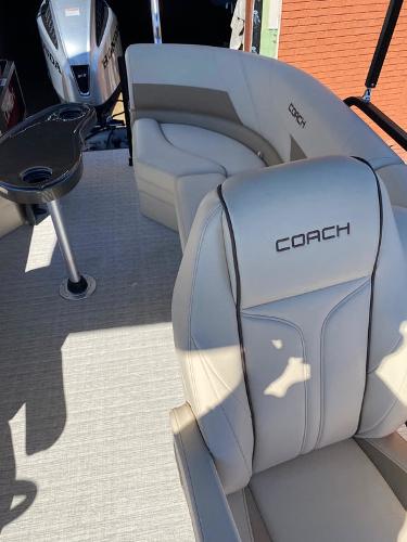 Slide: The Image of 2023 Coach Pontoons 223RFC interior with plush seating and modern design. - 6