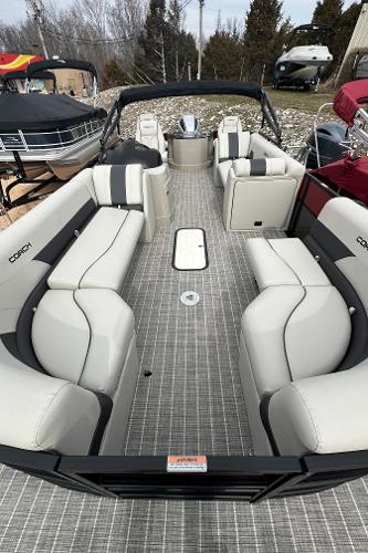 Slide: The Image of 2023 Coach Pontoons 243PFC pontoon boat with spacious seating and modern design. - 2