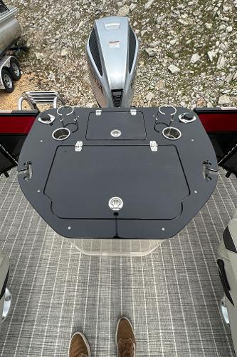 Slide: The Image of 2023 Coach Pontoons 243PFC boat deck with motor and cup holders. - 8