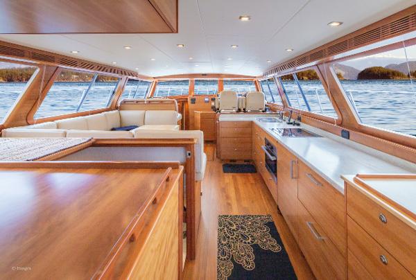Slide: The Image of Luxurious interior of 2012 Coastal Craft 56 yacht with modern kitchen and scenic ocean views. - 12