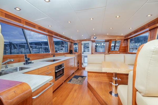 Slide: The Image of Luxurious interior of 2012 Coastal Craft 56 yacht with modern kitchen and seating area. - 13