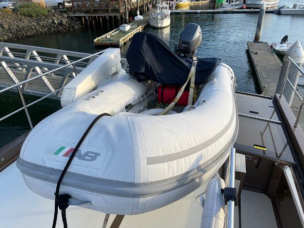 Slide: The Image of Inflatable boat on 2012 Coastal Craft 56 yacht, docked at marina. - 26
