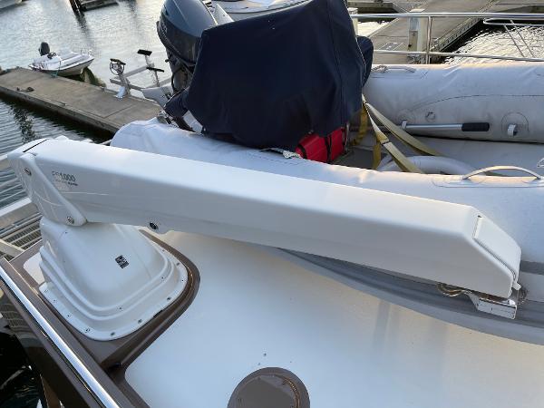 Slide: The Image of Coastal Craft 56 yacht deck with crane, 2012 model, docked at marina. - 28