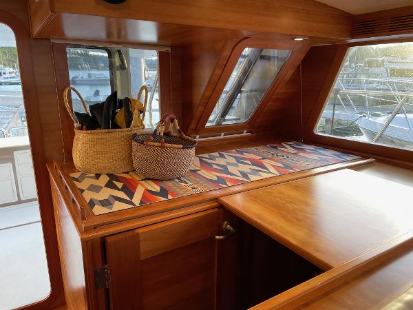 Slide: The Image of Luxurious 2012 Coastal Craft 56 yacht interior with wooden finish and decorative baskets. - 35