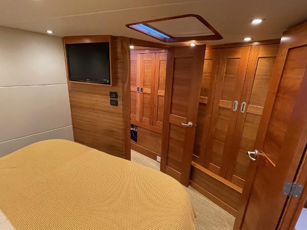 Slide: The Image of Luxurious cabin interior of 2012 Coastal Craft 56 yacht with wood paneling and TV. - 39