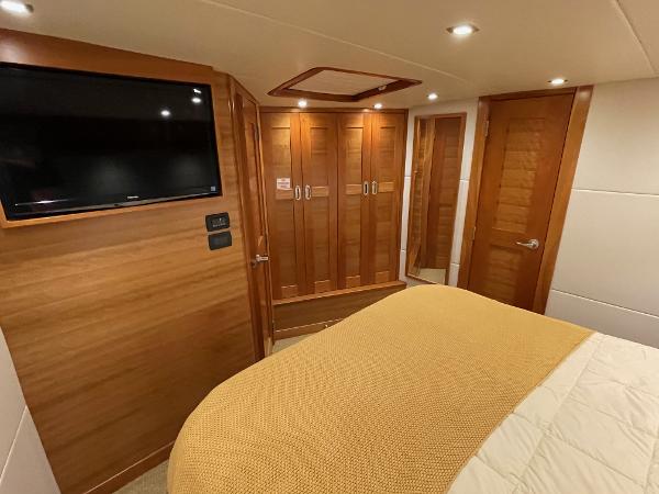 Slide: The Image of Luxurious cabin interior of 2012 Coastal Craft 56 yacht with wood finishes and TV. - 40