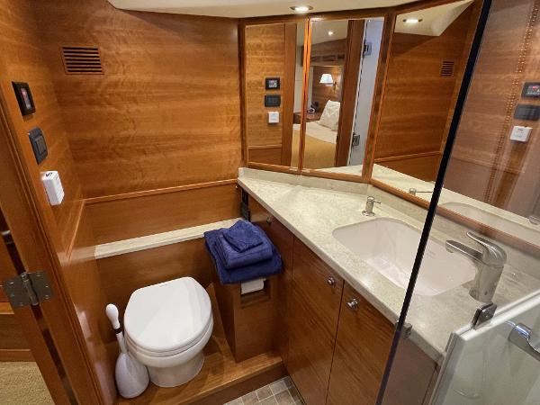 Slide: The Image of Luxurious bathroom in 2012 Coastal Craft 56 yacht with wood paneling and modern fixtures. - 42