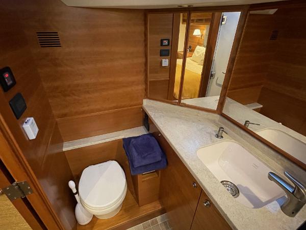 Slide: The Image of Luxurious bathroom in 2012 Coastal Craft 56 yacht with wood accents and modern fixtures. - 43